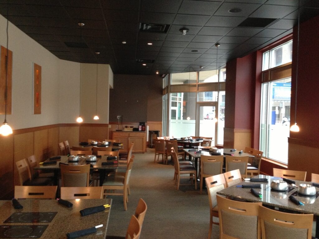 A restaurant with tables and chairs in it
