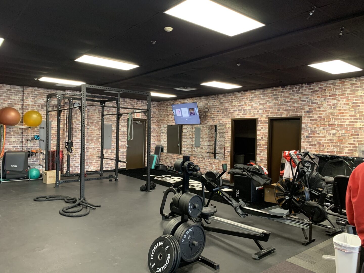 A gym with many different machines and equipment.