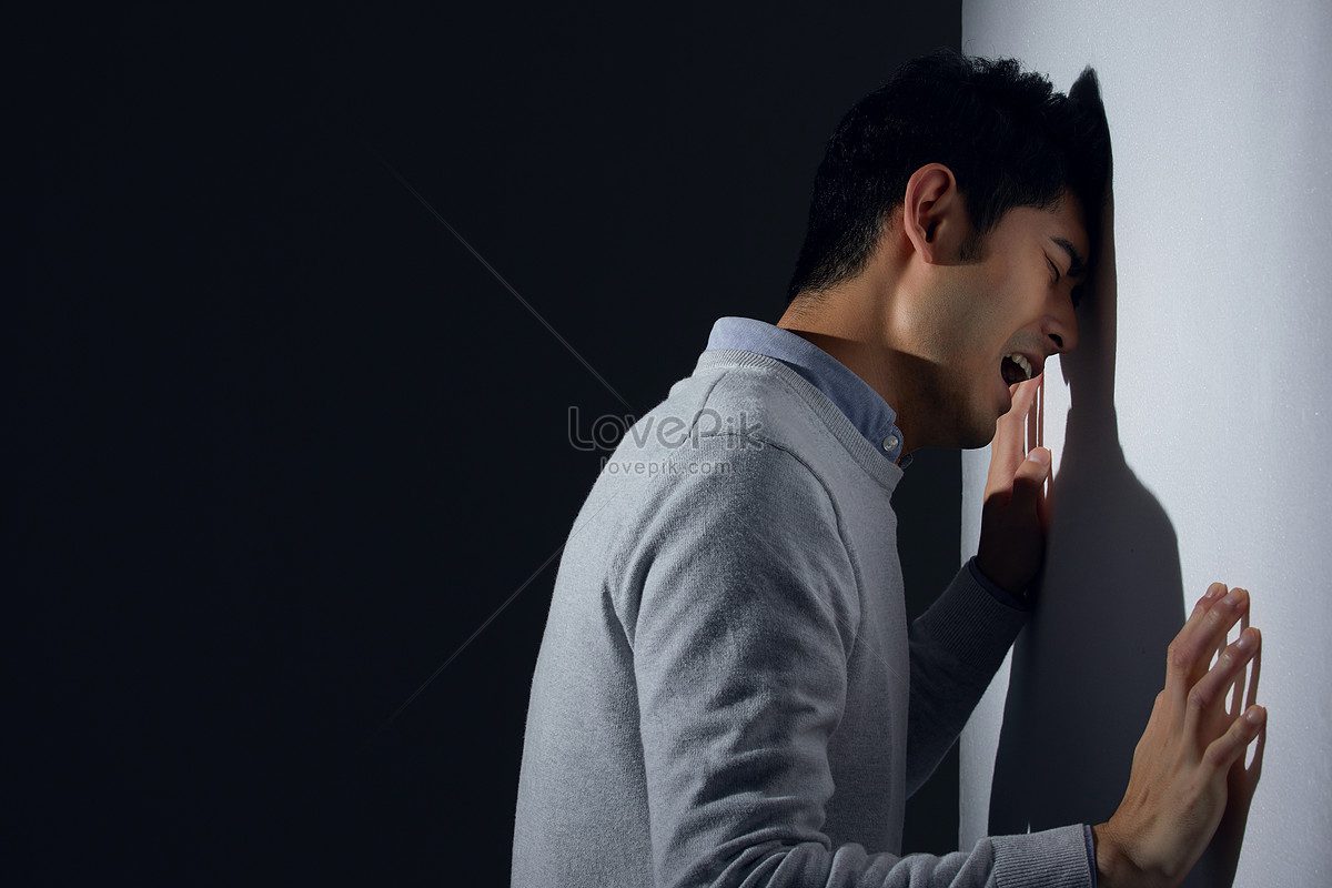 lovepik-young-male-suffering-facing-wall-picture_501528603